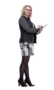 side view. a smiling woman writing something to the clipboard . isolated on a white background