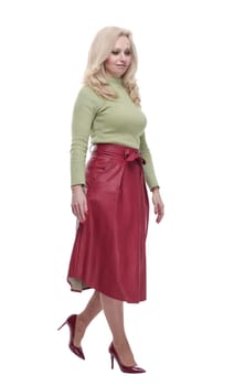 side view. friendly young woman standing in front of a white screen. isolated on a white background