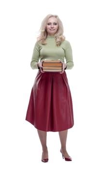 in full growth. an elegant woman with a stack of books . isolated on a white background