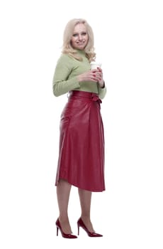 in full growth. attractive young woman with takeaway coffee. isolated on a white background