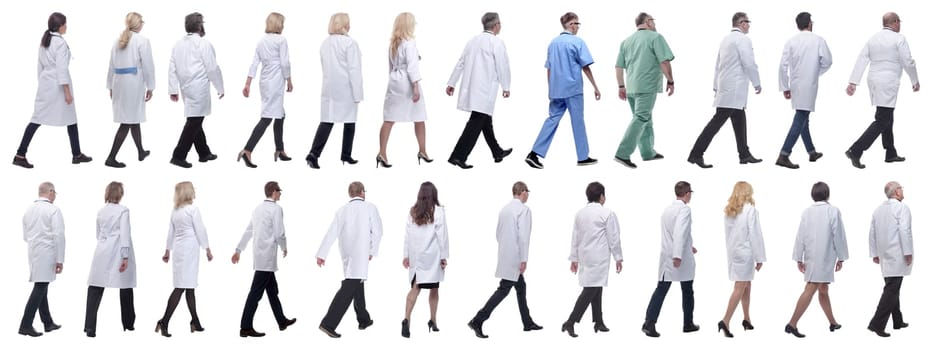 group of doctors in motion isolated on white background