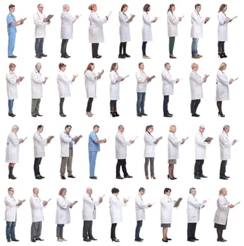 full length group of doctors with notepad isolated on white background