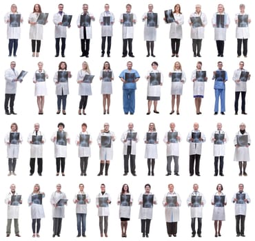 group of doctors holding x-ray isolated on white background