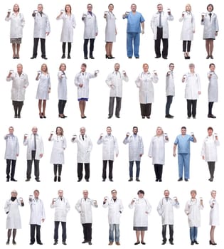 full length group of doctors showing badge isolated on white background