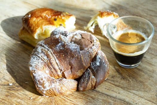 morning breakfast with espresso and chocolate croissant