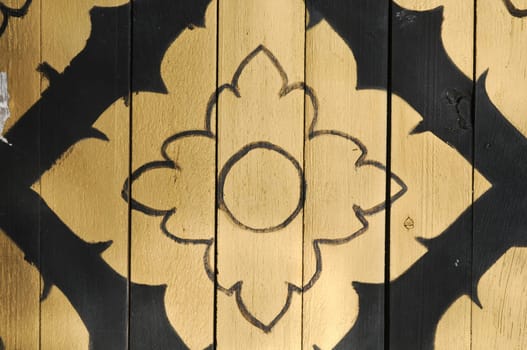 Thai style traditional golden pattern drawing on wooden board