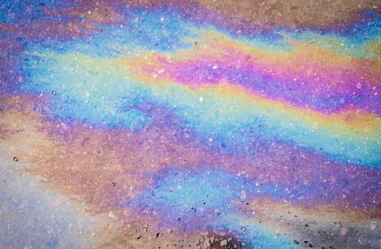 Oil stain, Gas Stain drop from the Car on the Parking Lot Floor. Environmental pollution concept