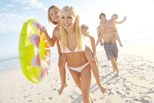The perfect summer vacation. a happy young family having fun at the beach