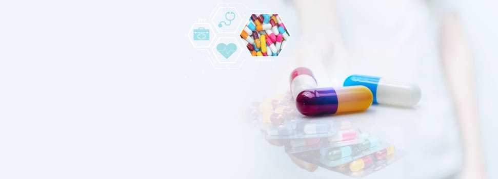 Antibiotic capsule pills and prescription drugs banner. Health care and medicine. Pharmacists prescribed medicine. World pharmacist day. Medical care in hospital. Doctor giving pills.                             