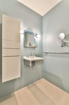 a bathroom with a sink and mirror on the wall above it is an image of someone's reflection in the mirror