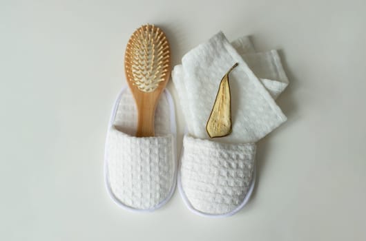 pattern, fabric shoes, shower slippers, massage brush, dried pear, lies on the table