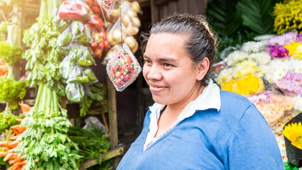 Latina Woman selling fruits and vegetables in front of her stretch on the street