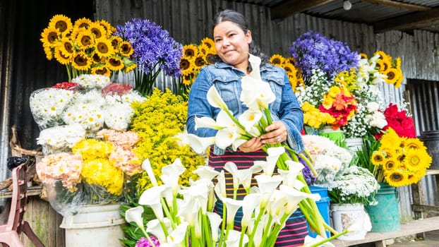 Retailer selling natural flowers in its street sales section of Nicaragua, Central America, Latin America