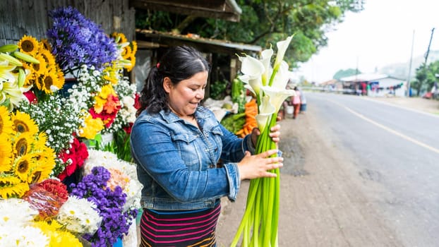 Flower seller contributing to the local economy in Nicaragua, Central America, Latin America