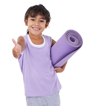 She wants to be a yoga instructor when she grows up. An adorable little girl with a yoga mat showing approval