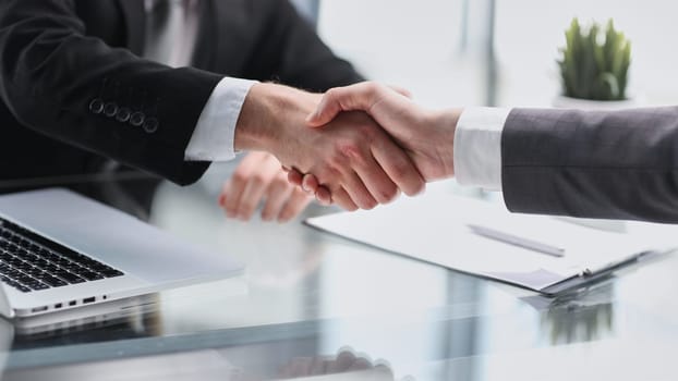 Professional business people reached agreement on negotiations.