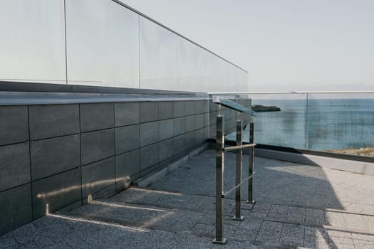 Panoramic view of the city. An observation deck with a figured fence and a lantern. City view.