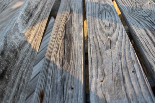 Wood bridge benches over river close up old . High quality photo