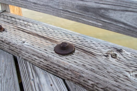 Wood bridge board bolts close up old . High quality photo