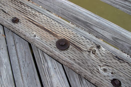 Wood bridge board bolts close up old . High quality photo