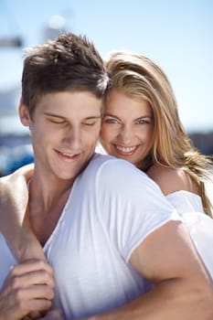 Romantic, love and couple on a date together feeling happy on vacation or holiday with happiness in summer. Portrait, travel and woman hug man in a relationship and smile outdoor with care.