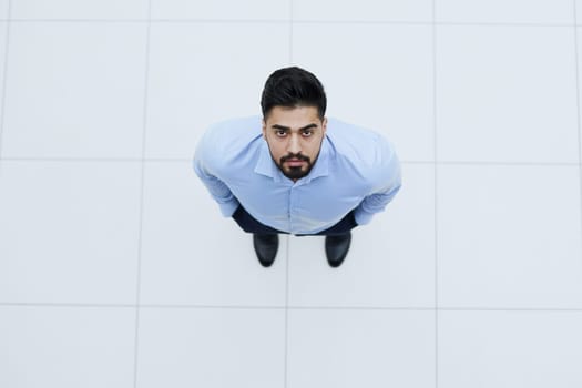top view young businessman looking up and thinking about something