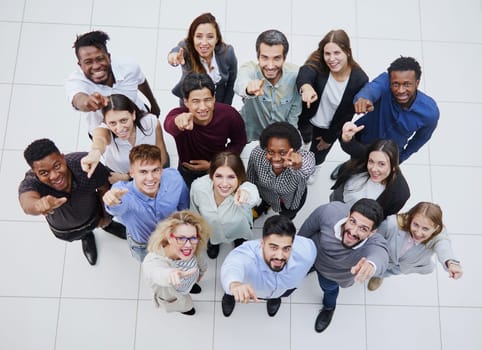 a group of young people pointing up somewhere