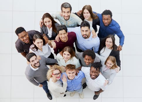 A large group of young people look up.