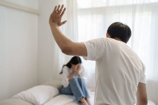 Domestic violence and Family conflict concept, father fighting mother with quarrel at home