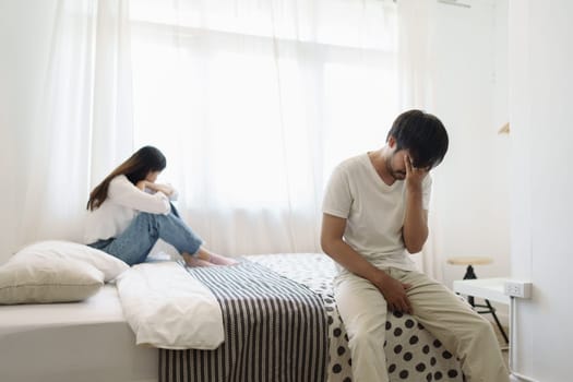 Young couple lying in bed in bedroom at home, woman in lingerie sleeping, sad, frustrated man thinking about relationships, family having sexual problems, erectile dysfunction concepts