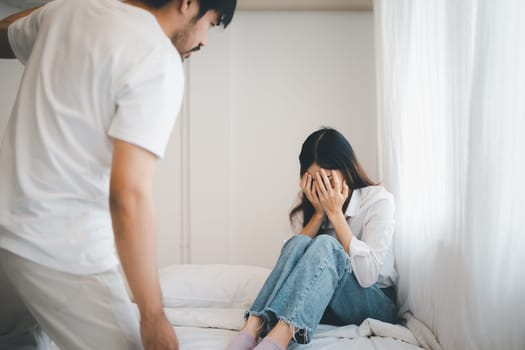 Domestic violence and Family conflict concept, father fighting mother with quarrel at home