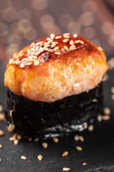 Baked shrimp gunkan isolated on white background. Simple gunkan sushi with shrimp tartare in minimal style. Japanese food - nigiri sushi in nori. Nigiri sushi with fish