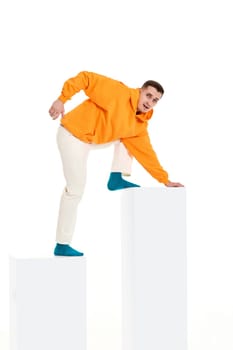 young man trying going up the bar chart. Business processes concepts. guy following up on white diagram
