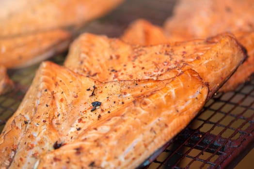 Grilled Atlantic salmon fillet. The process of smoking red fish fillet. High quality photo