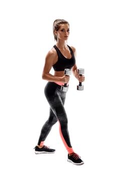 Strong woman exercising with dumbbells for arms. Photo of woman working out with dumbbells on white background. Strength and motivation.