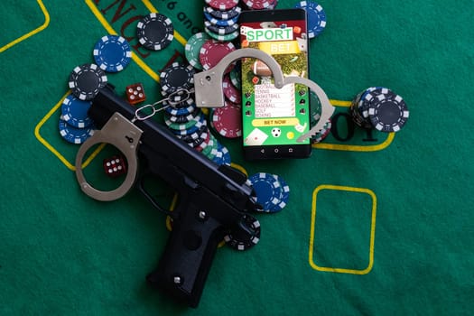 smartphone with sports betting, handcuffs, gun gambling shoot.