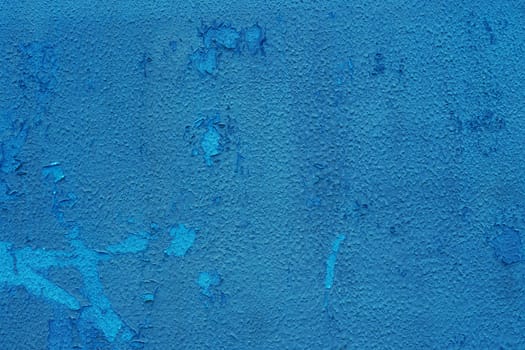 Abstract background for design with copy space. Blue peeling paint on the wall