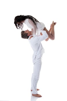 Image of emotional young couple dancing in studio, isolated on white