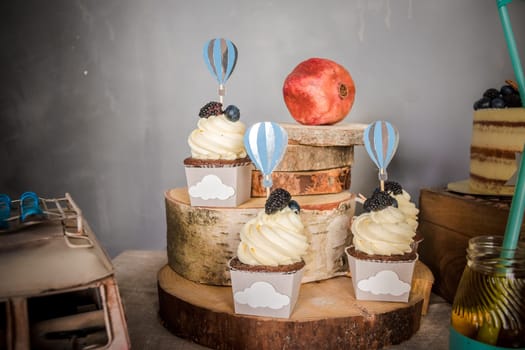 Buffet with sweets. Sweet, colorful cupcakes. Sweet table for banquets, weddings, parties Candy bar