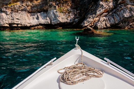 Summer time view from yacht gangway on the small beach of Love bay Poros island Greece.