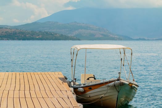 Motor boats drifting in the deep blue sea on Croatian coast.Adriatic Sea background.Crystal clear water,good sunny weather.Beautiful blue lagoon for summer vacation trip