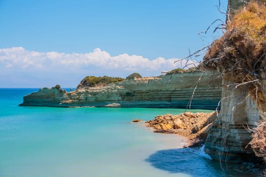 View on amazing island rock mountains bay in Ionian Sea clear blue water and Blue Caves. Green rocks in blue sea landscape.