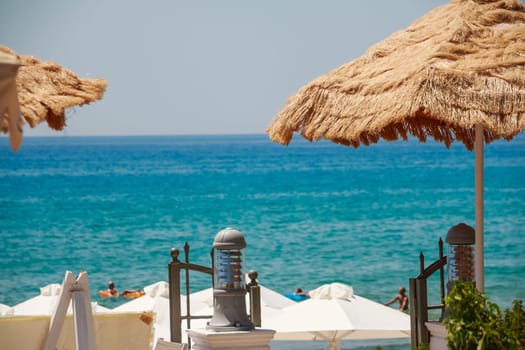 Summer Seaside Restaurant Terrace or Veranda Interior, Flattering Curtains, Metal Lanterns, White Wooden Furniture, Sea View.