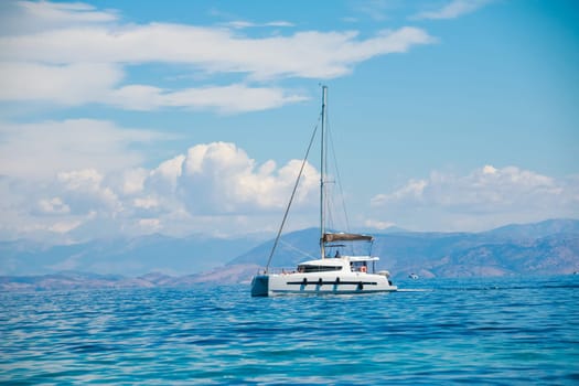 A single catamaran in the open sea. Boat vacation concept