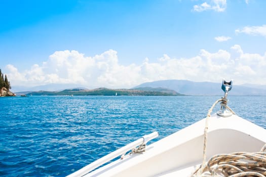 Boat bow sailing in blue Mediterranean sea in summer vacation