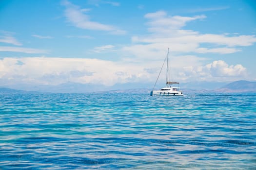 Catamaran at sea. Summer sport holiday.sailing boat near coast