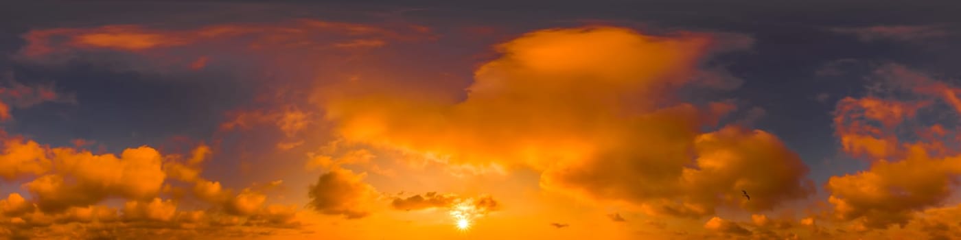 Blue Orange evening sky Seamless spherical equirectangular panorama 360-degree view with beautiful Stratocumulus clouds, setting sun - for use in 3D graphics as a sky dome or post-processing of drone images.