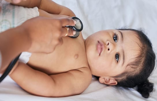 Healthcare, heartbeat and baby with a doctor for a checkup, medical attention and consulting. Hospital, patient and above of a child with a pediatrician for an exam, test and examination at a clinic.