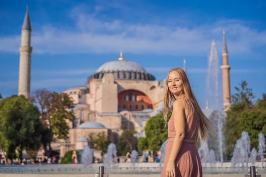 Woman enjoy beautiful view on Hagia Sophia Cathedral, famous islamic Landmark mosque, Travel to Istanbul, Turkey. Sunny day architecture and Hagia Sophia Museum, in Eminonu, istanbul, Turkey. Turkiye.