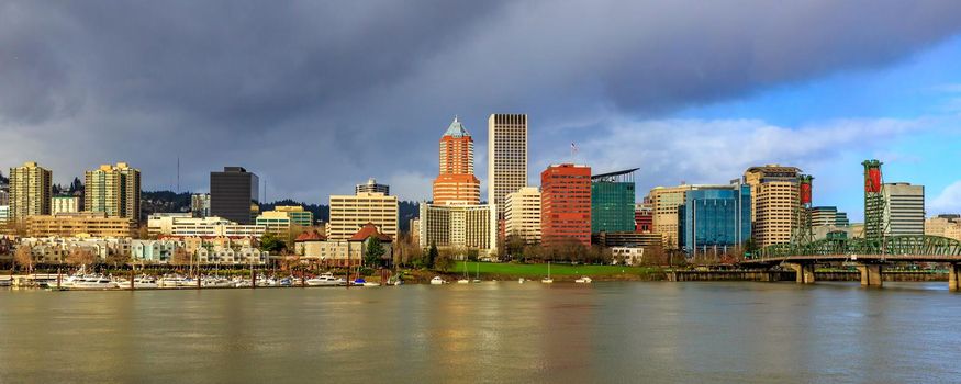Portland, Oregon - Janurary 29, 2016: Portland downtown skyline showing Wells Fargo Center and KOIN Center, behind Willamette river and waterfront park.